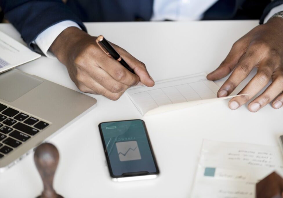 Businessman checking bankbook Businessman checking bankbook
